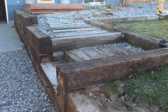 the happy crazy hosue railroad tie retaining wall and stairs